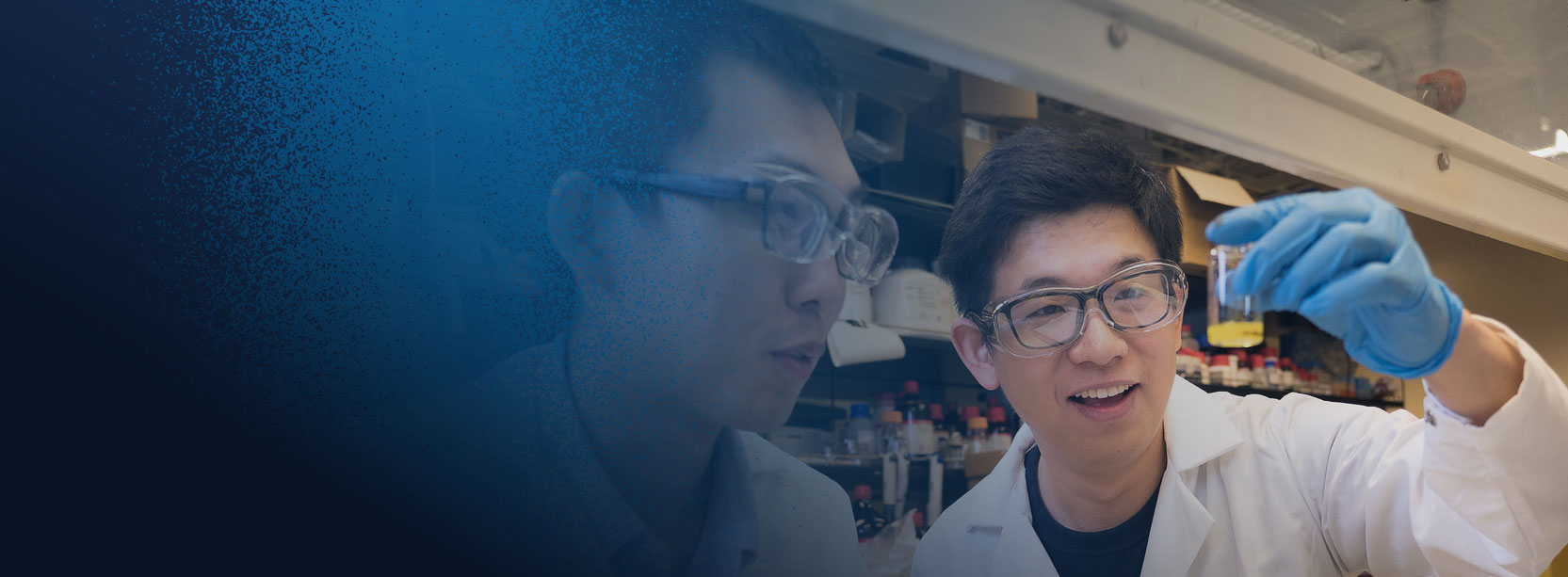 Researchers examining a sample in a lab at UC San Diego